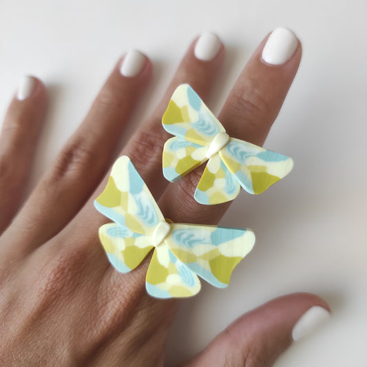 Yellow and light blue butterfly ring