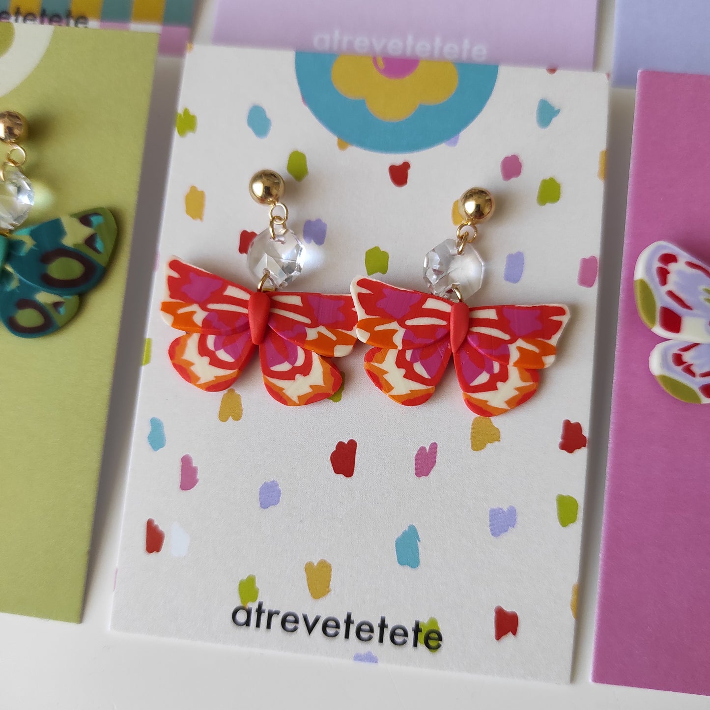 Pendientes mariposa naranja y fucsia