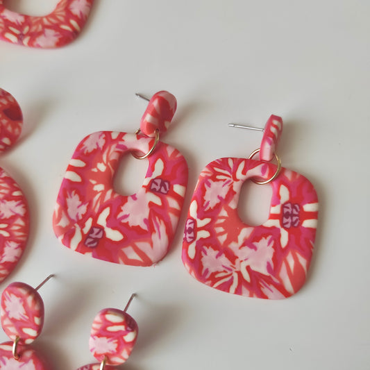 Amelia  flores rojas, rosas y naranjas